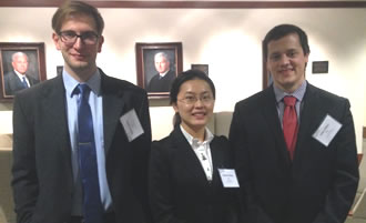 Students Iurie Cuciuc, Haixin Zhang, and John P. Miller at the Jessup moot court competition in Chicago