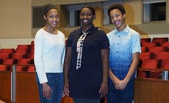 The Deyoung family: daughter Jasmin, mother Shashan, and son Tarrin in the Wynne Courtroom