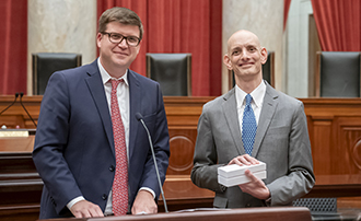 two men in the U.S. Supreme Court Courtroom, one of whom has been given an award