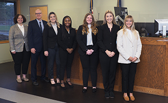 law students and law professor in small claims courtroom where they will help tenants facing eviction