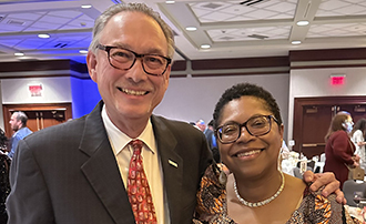 two people in a crowded ballroom