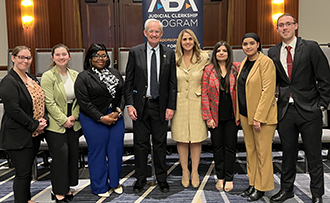 people standing in front of a banner