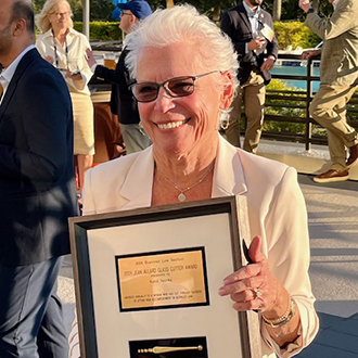 Woman holding an award