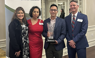 From left are Assistant Dean of Diversity and Inclusion Patricia Kinney, J.D. ’02; Dr. Zelideh R. Martinez Hoy; Dr. David Hoa Khoa Nguyen, J.D. ’06; and IBA president David Duncan, J.D. ’04. 