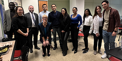 A group of students and staff gathered in the cafeteria for Thanksgiving