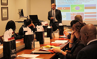 Professor Schaibley with International Visitors