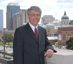 Dean Gary R. Roberts in front of Downtown Indianapolis