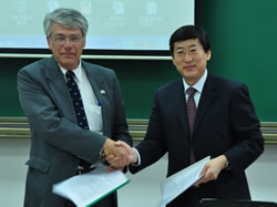 Dean Roberts and Dean Han shaking hands