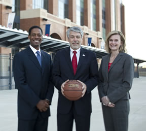 Bill Brooks, '12; Dean Gary R. Roberts; and Julie Roe Lach, '04