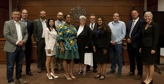 Photo of Director Cynthia Baker with Symposium participants.